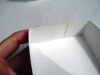 Learn to make tiny gift boxes out of last year's greeting cards
